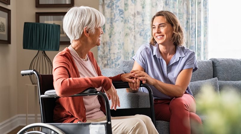 Happy adult woman visiting her elderly mother at home